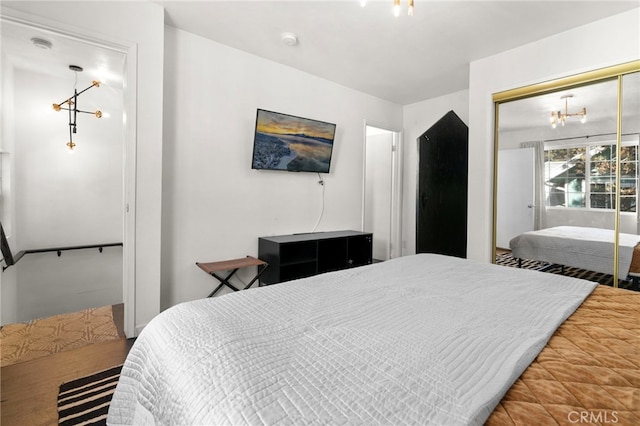 bedroom featuring a closet and a chandelier