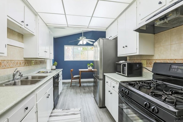 kitchen with black appliances, ceiling fan, tasteful backsplash, and white cabinetry