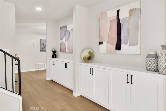 hallway featuring light hardwood / wood-style flooring