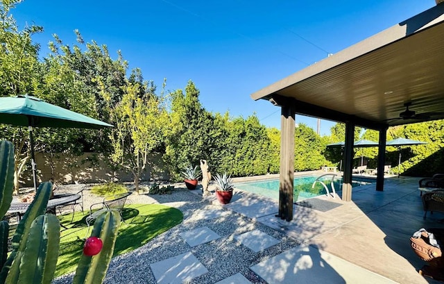 view of patio with ceiling fan