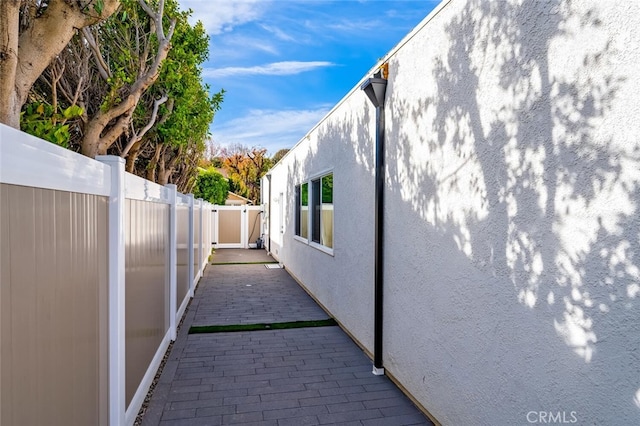 view of property exterior featuring a patio