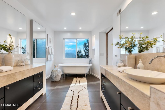 bathroom featuring vanity and a bathtub