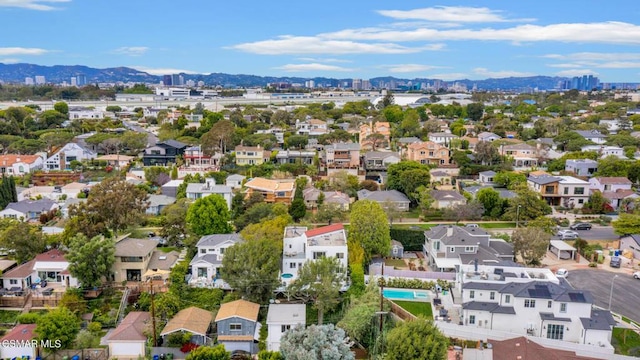 birds eye view of property with a mountain view