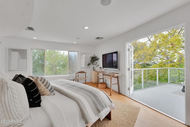 bedroom with light hardwood / wood-style floors