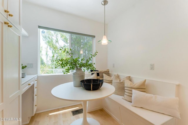 dining room with breakfast area and light hardwood / wood-style flooring