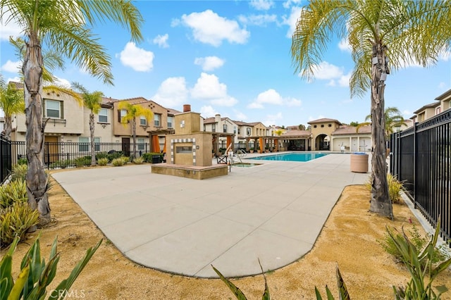 view of swimming pool with a patio area