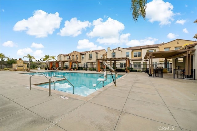 view of swimming pool with a pergola and a patio area