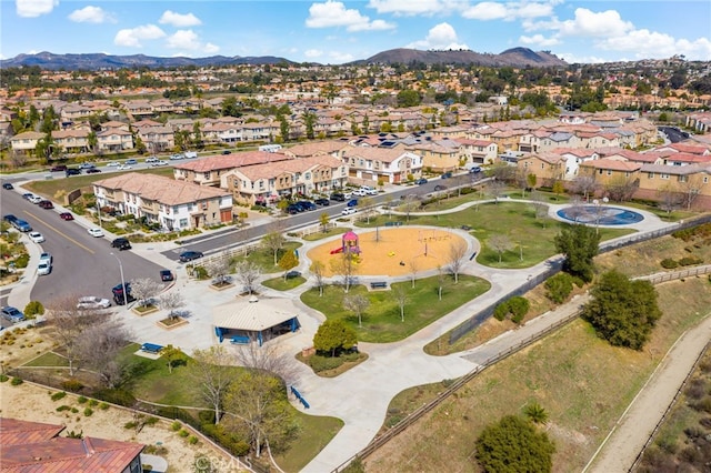 birds eye view of property with a mountain view