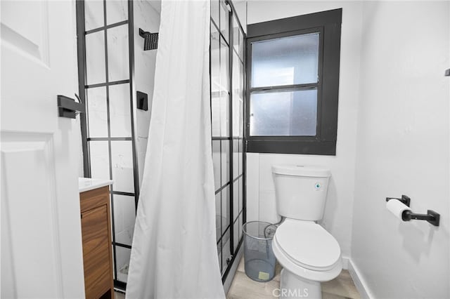 bathroom with toilet, vanity, and a shower with shower curtain