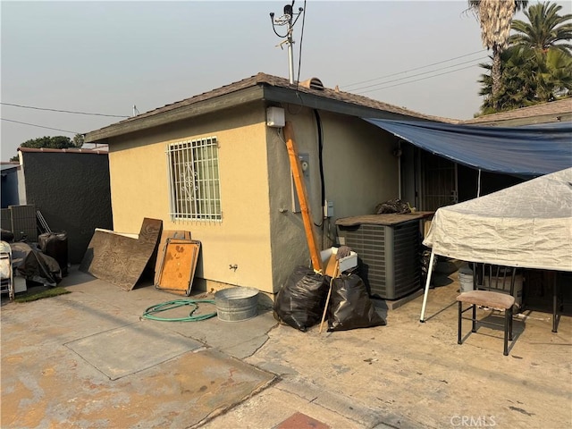 rear view of property featuring a patio area