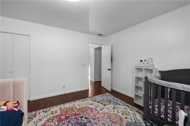 bedroom featuring dark hardwood / wood-style flooring