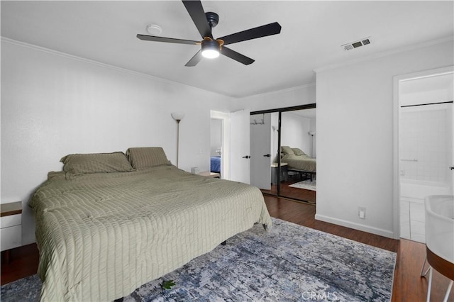 bedroom with ceiling fan, a closet, dark hardwood / wood-style flooring, and connected bathroom