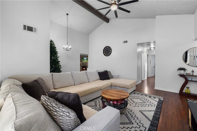 living room with dark wood-type flooring, beam ceiling, ceiling fan with notable chandelier, and high vaulted ceiling