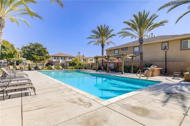 view of pool featuring a patio area and a pergola