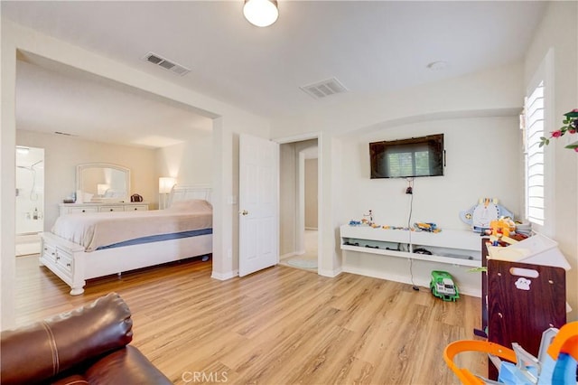 bedroom with light hardwood / wood-style floors