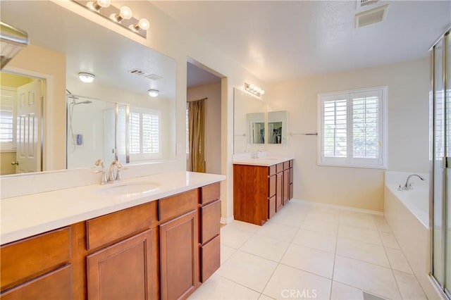 bathroom featuring vanity, separate shower and tub, and tile patterned flooring