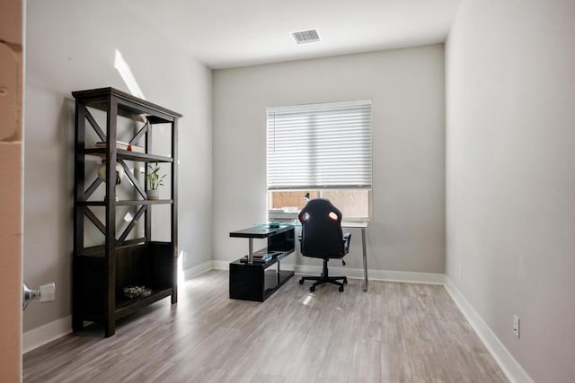 home office with light wood-type flooring