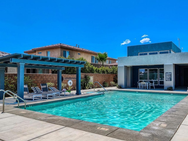 view of swimming pool featuring a pergola and a patio area