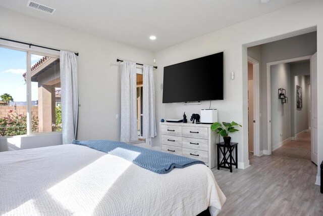 bedroom with light wood-type flooring