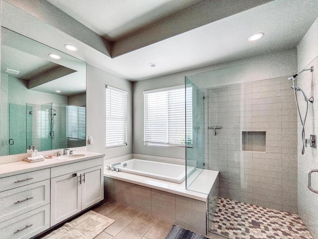 bathroom with vanity and separate shower and tub