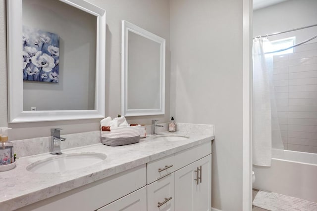 full bathroom featuring toilet, vanity, and shower / bath combo with shower curtain