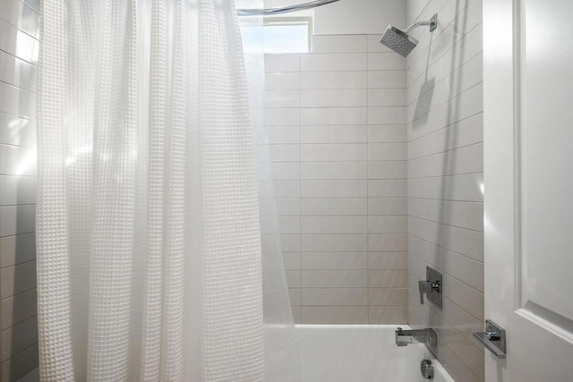 bathroom featuring shower / bath combo with shower curtain