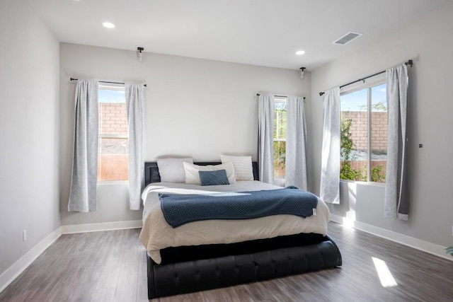 bedroom featuring dark wood-type flooring