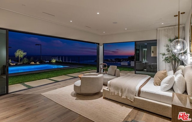 bedroom with wood-type flooring and golf simulator