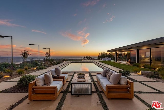 patio terrace at dusk with an outdoor hangout area