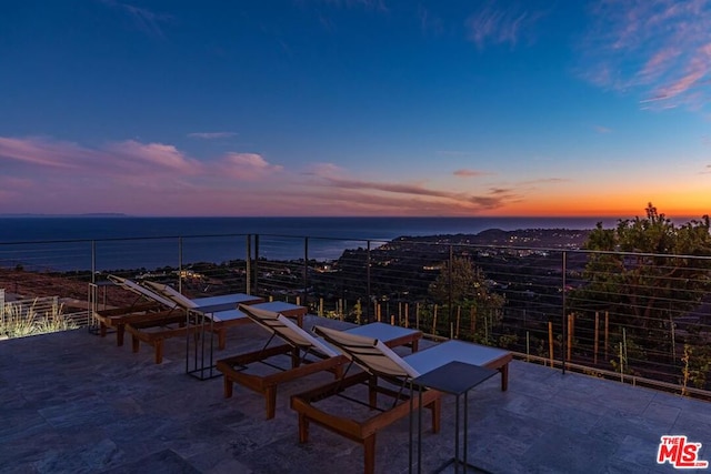 patio terrace at dusk with a water view