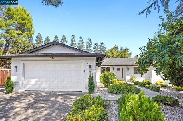 ranch-style house featuring a garage