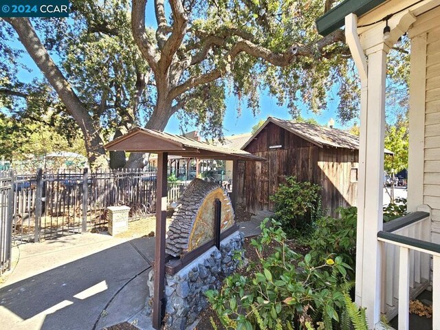 view of patio with a storage shed