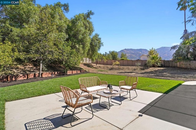 view of patio / terrace with a mountain view