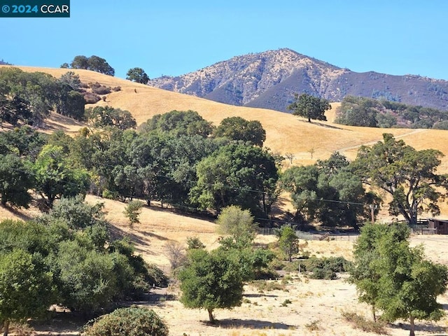 property view of mountains featuring a rural view