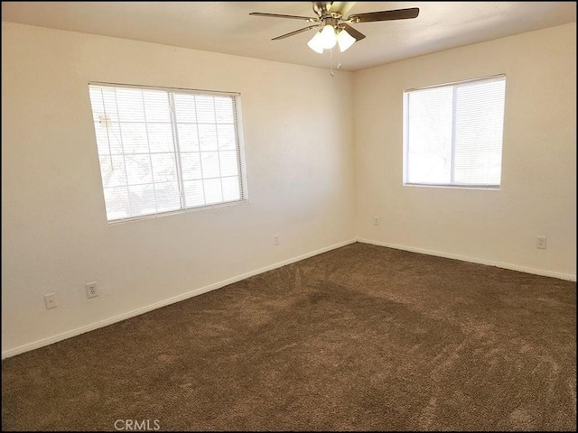 carpeted empty room featuring ceiling fan