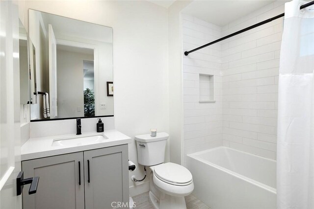 full bathroom featuring toilet, vanity, and shower / tub combo