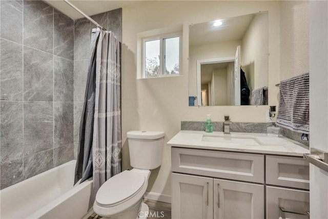 full bathroom featuring toilet, vanity, and shower / bath combo