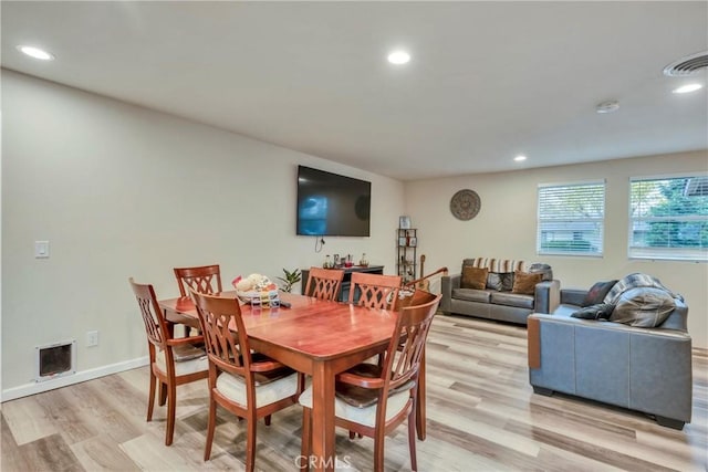 dining area with light hardwood / wood-style flooring