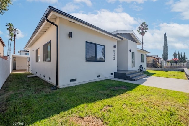 view of property exterior featuring a yard