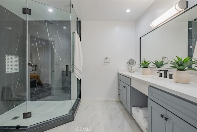 bathroom with walk in shower and vanity