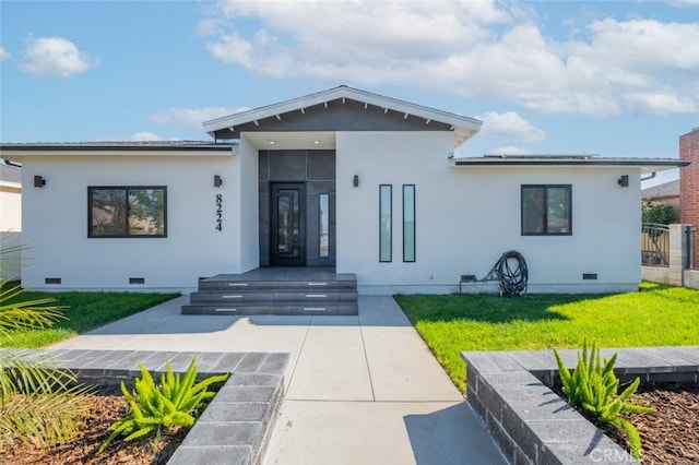 view of front of home with a front yard