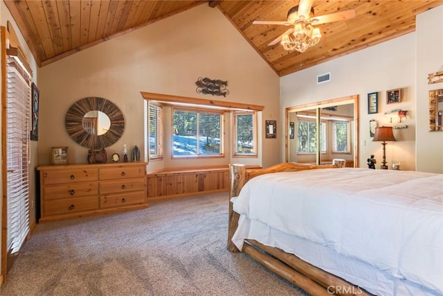 carpeted bedroom featuring wood ceiling and high vaulted ceiling