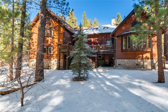 view of snow covered house