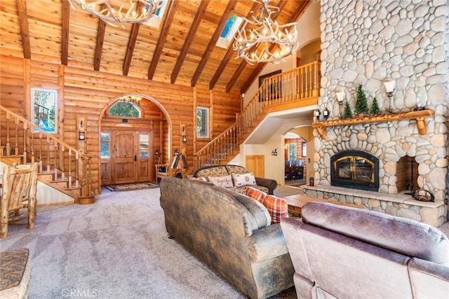 unfurnished living room featuring beam ceiling, wood ceiling, high vaulted ceiling, a fireplace, and carpet