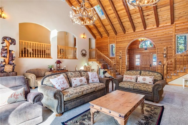 carpeted living area featuring high vaulted ceiling, wood ceiling, beamed ceiling, and stairs