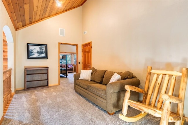 living room with light carpet, vaulted ceiling, and wooden ceiling