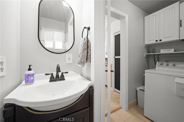 bathroom featuring vanity, washer / dryer, tile patterned floors, and toilet