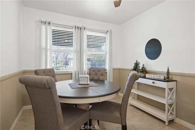 dining space featuring light tile patterned floors and ceiling fan