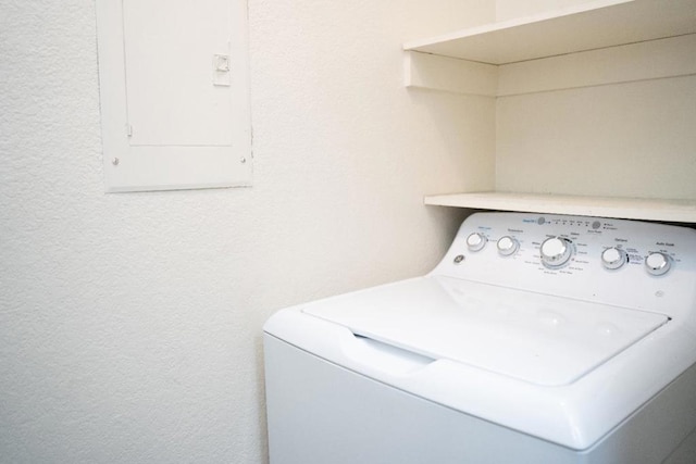 clothes washing area featuring washer / clothes dryer and electric panel