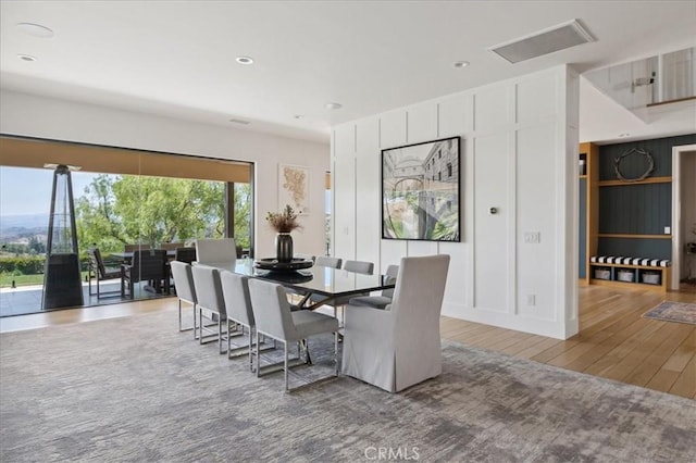 dining room with hardwood / wood-style flooring